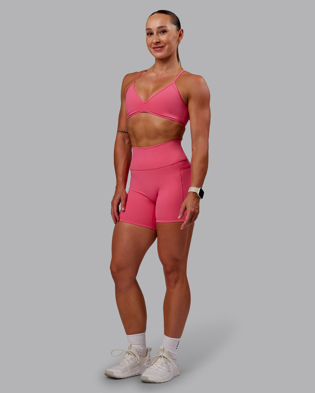 Woman wearing Fusion Ultra High-Rise 6&quot; Short Pockets - Hot Pink | Model:Amber | Size:S