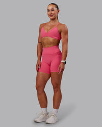 Woman wearing Fusion Ultra High-Rise 6" Short Pockets - Hot Pink | Model:Amber | Size:S