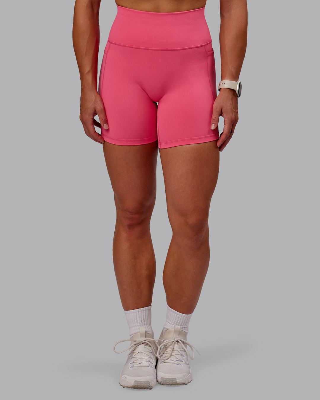 Woman wearing Fusion Ultra High-Rise 6&quot; Short Pockets - Hot Pink | Model:Amber | Size:S