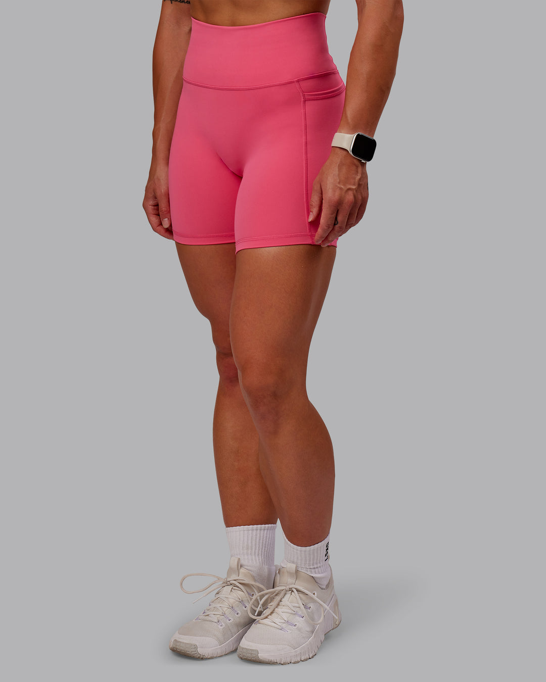 Woman wearing Fusion Ultra High-Rise 6&quot; Short Pockets - Hot Pink | Model:Amber | Size:S