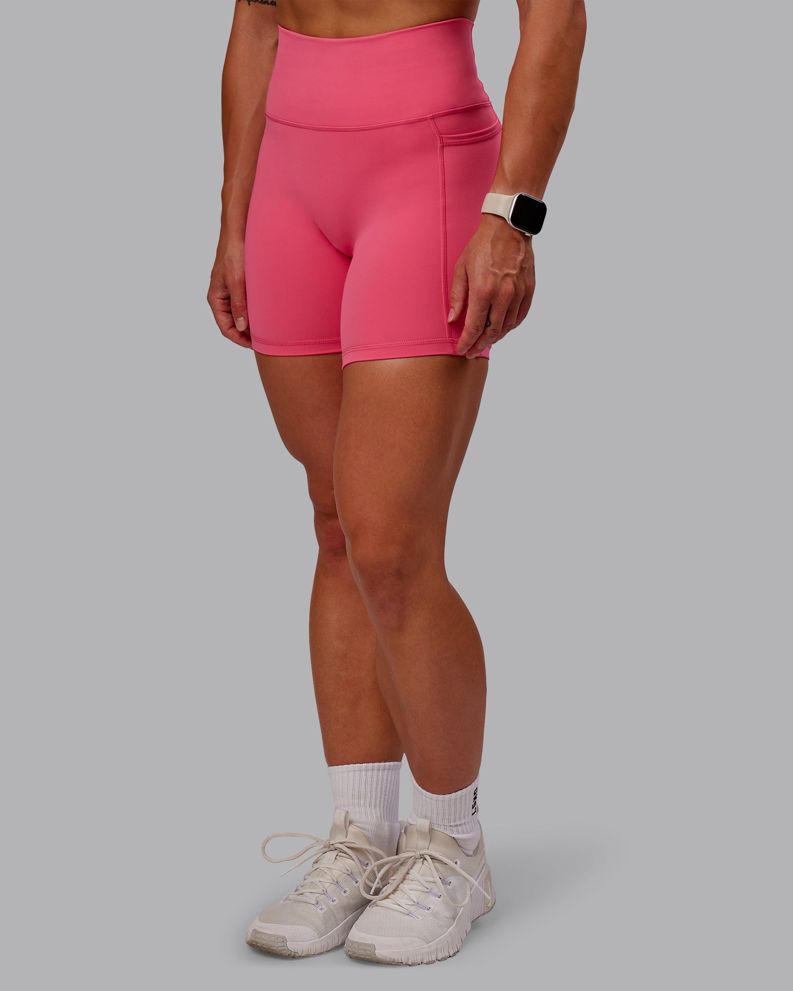 Woman wearing Fusion Ultra High-Rise 6" Short Pockets - Hot Pink | Model:Amber | Size:S