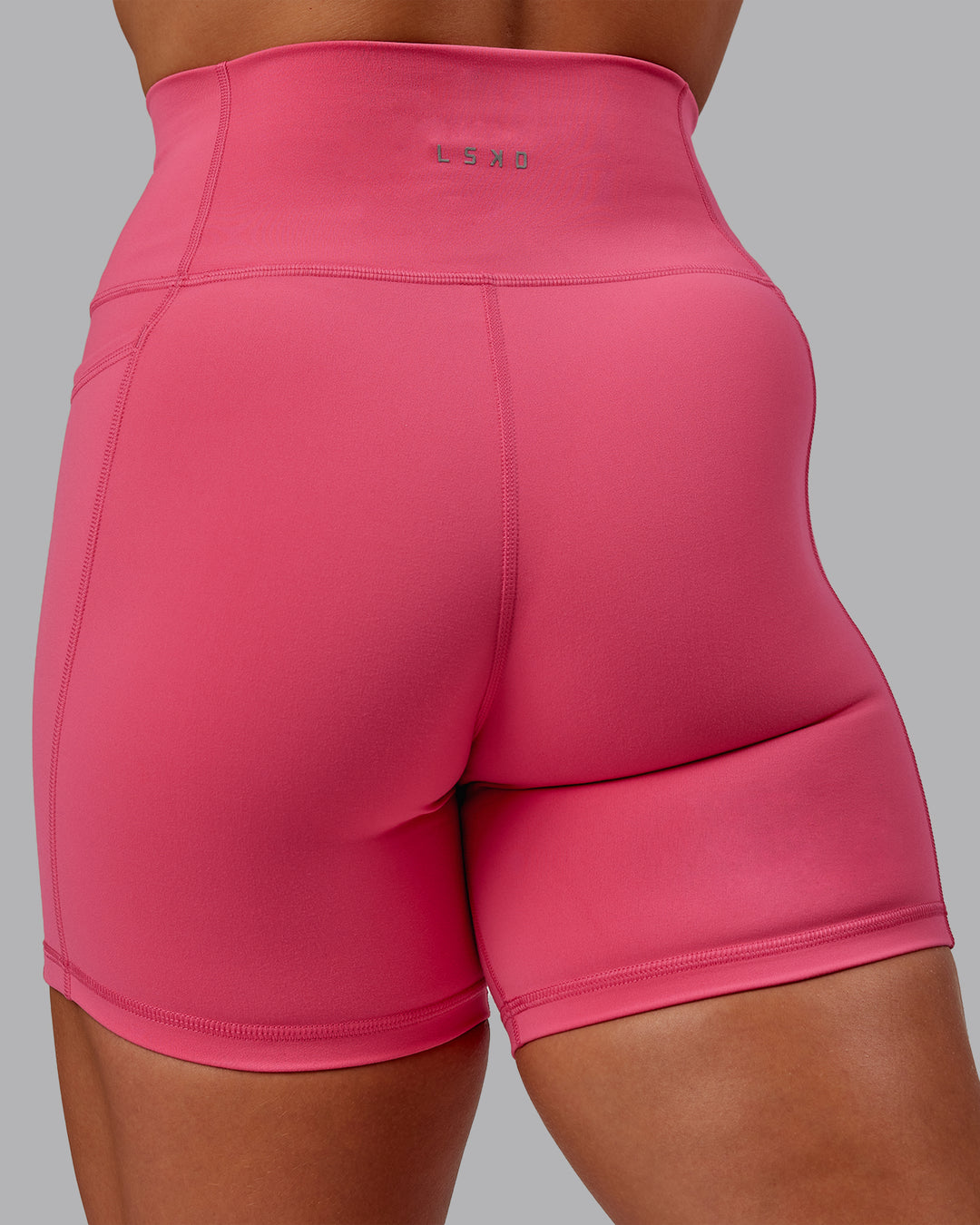 Woman wearing Fusion Ultra High-Rise 6&quot; Short Pockets - Hot Pink | Model:Amber | Size:S