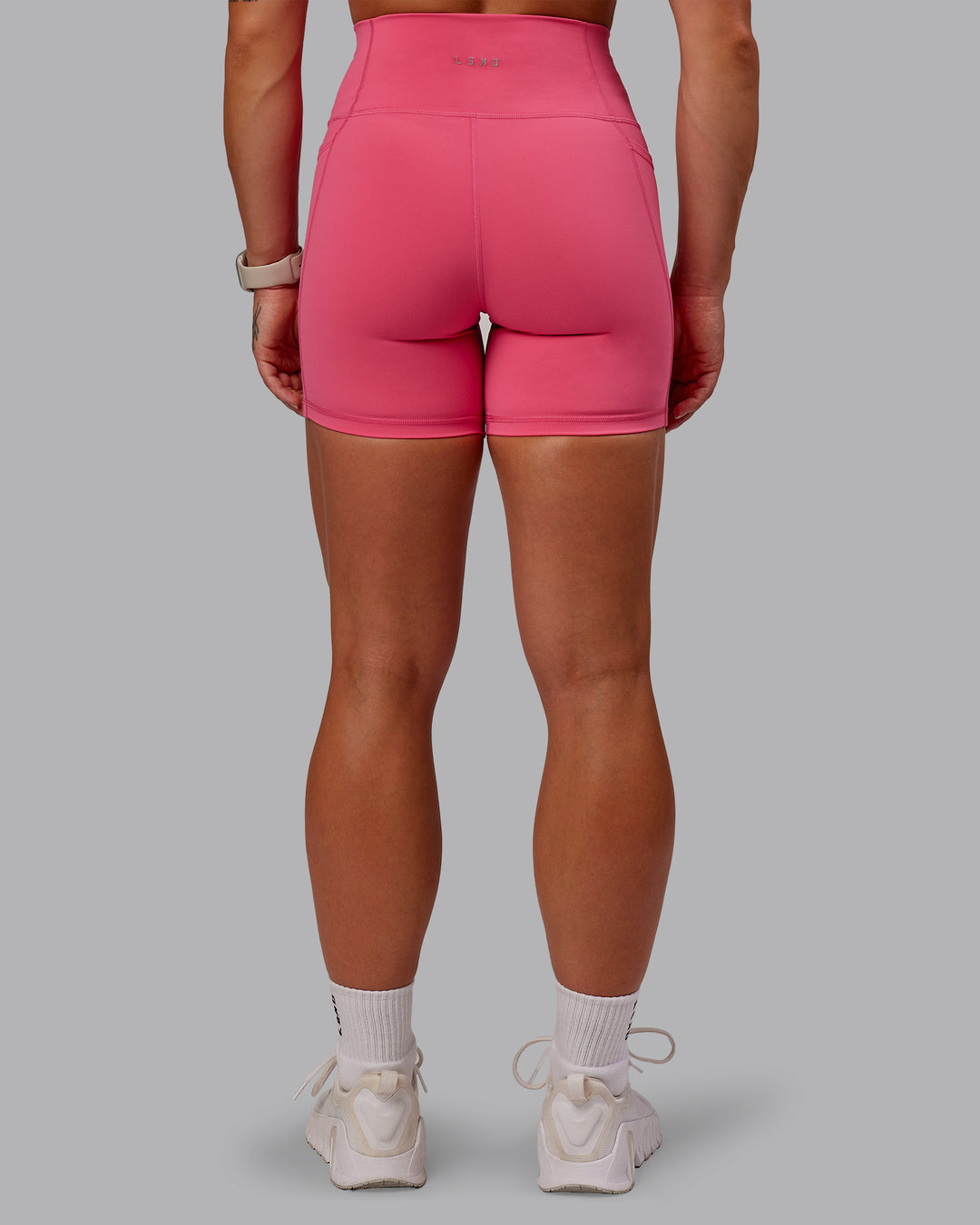 Woman wearing Fusion Ultra High-Rise 6&quot; Short Pockets - Hot Pink | Model:Amber | Size:S