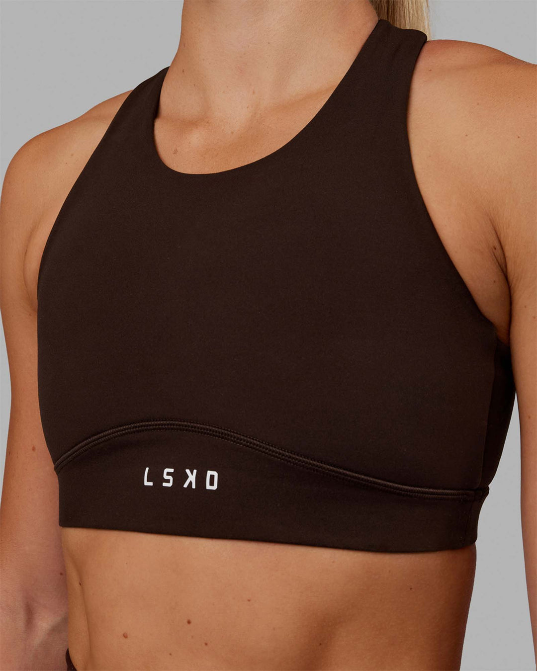 Woman wearing Fusion Sports Bra - Dark Chocolate
