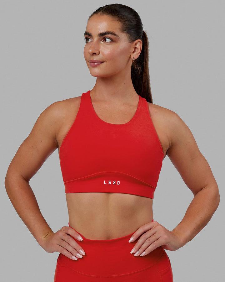 Woman wearing Fusion Sports Bra - Infrared
