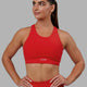 Woman wearing Fusion Sports Bra - Infrared