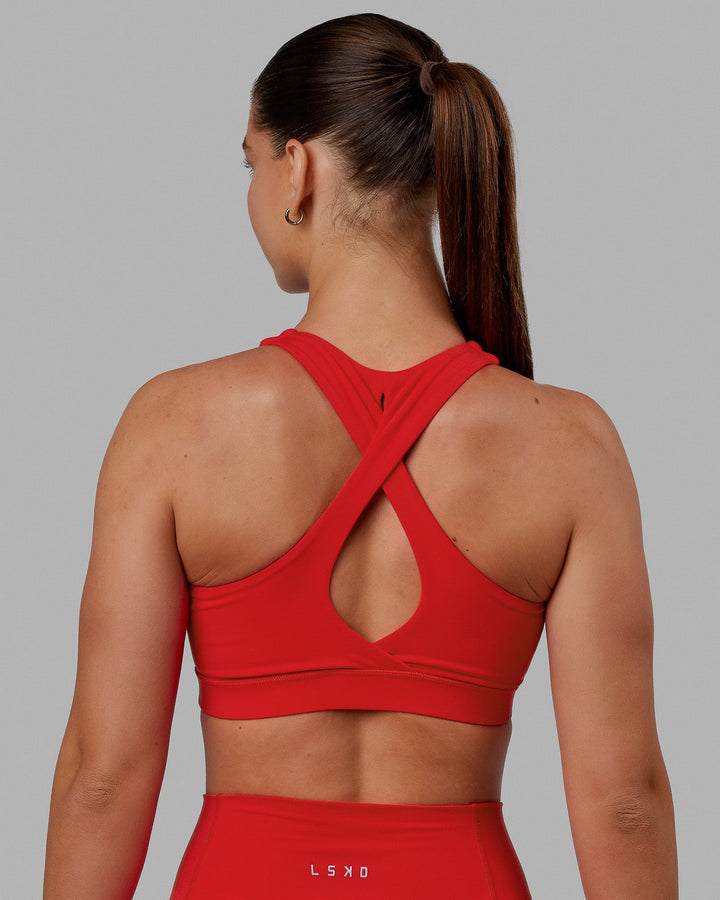 Woman wearing Fusion Sports Bra - Infrared