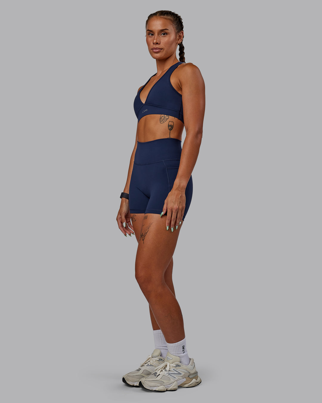 Woman wearing Fusion Ultra High-Rise 4&quot; Short Pockets - Future Navy | Model:Vanessa | Size:S