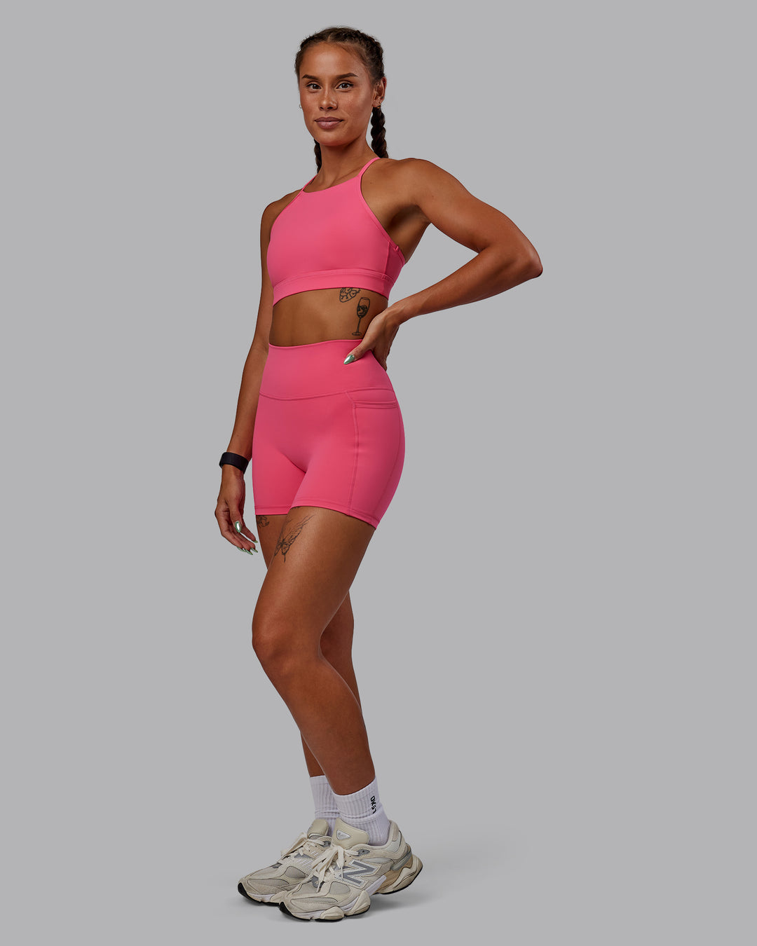 Woman wearing Fusion Ultra High-Rise 4&quot; Short Pockets - Hot Pink | Model:Vanessa | Size:S