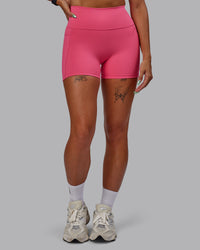 Woman wearing Fusion Ultra High-Rise 4" Short Pockets - Hot Pink | Model:Vanessa | Size:S