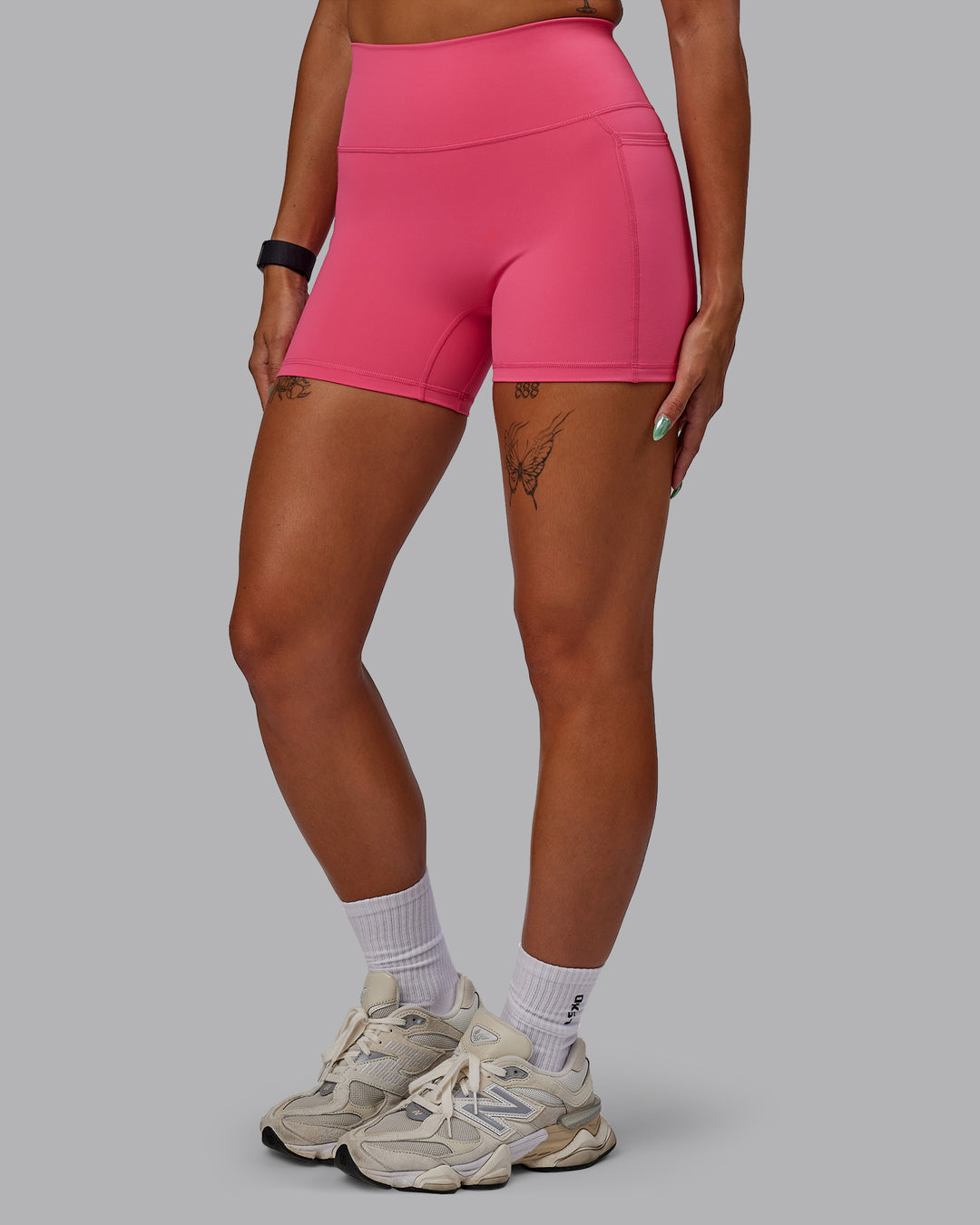 Woman wearing Fusion Ultra High-Rise 4&quot; Short Pockets - Hot Pink | Model:Vanessa | Size:S