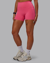 Woman wearing Fusion Ultra High-Rise 4" Short Pockets - Hot Pink | Model:Vanessa | Size:S