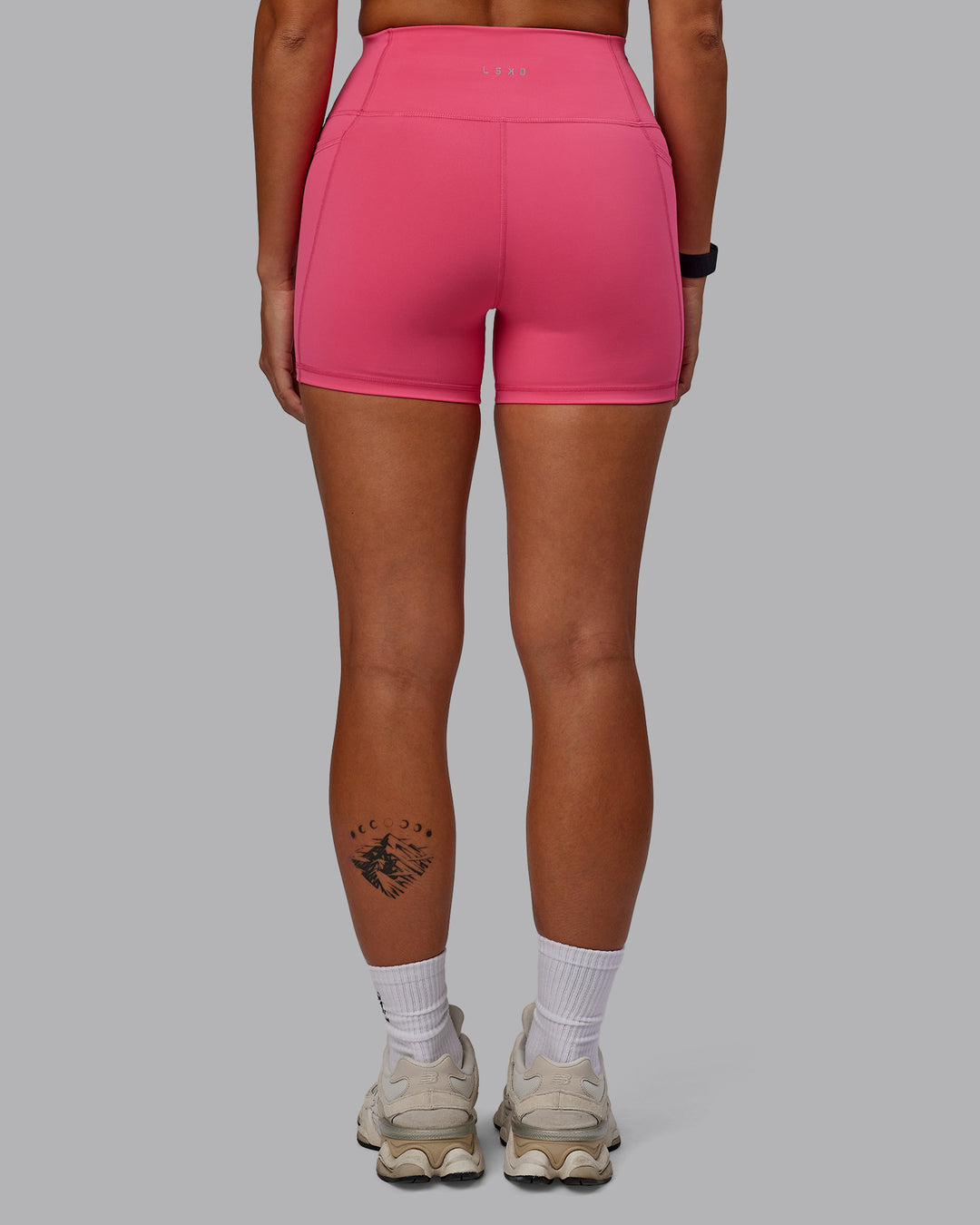 Woman wearing Fusion Ultra High-Rise 4&quot; Short Pockets - Hot Pink | Model:Vanessa | Size:S