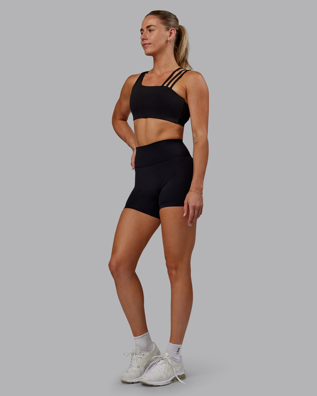 Woman wearing Fusion Ultra High-Rise 4&quot; Short - Black | Model:Hannah | Size:S