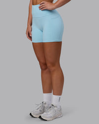Woman wearing Fusion Ultra High-Rise 4" Short Pockets - Glacial Blue | Model:Monique | Size:S