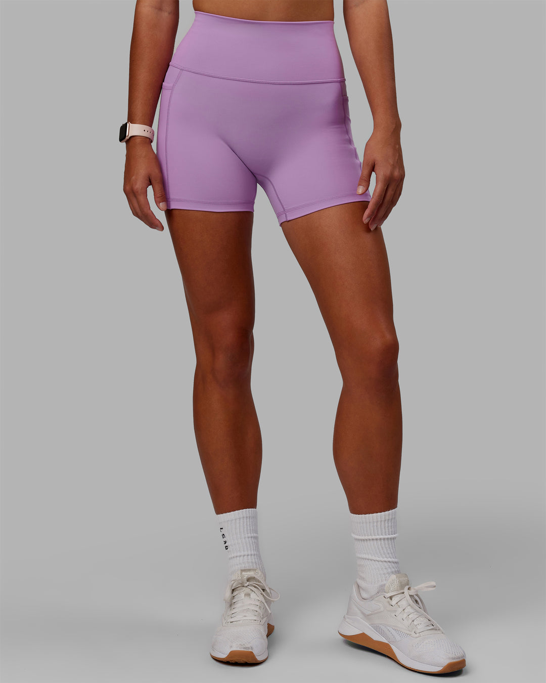 Woman wearing Fusion Ultra High-Rise 4&quot; Short Pockets - Light Violet | Model:Asia | Size:S