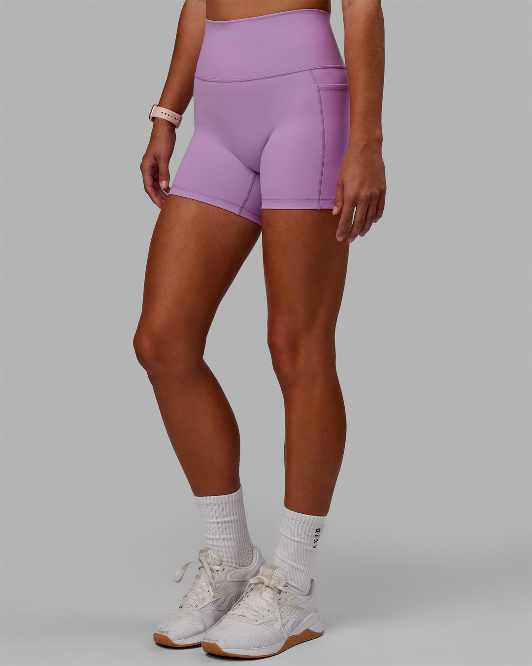 Woman wearing Fusion Ultra High-Rise 4&quot; Short Pockets - Light Violet | Model:Asia | Size:S