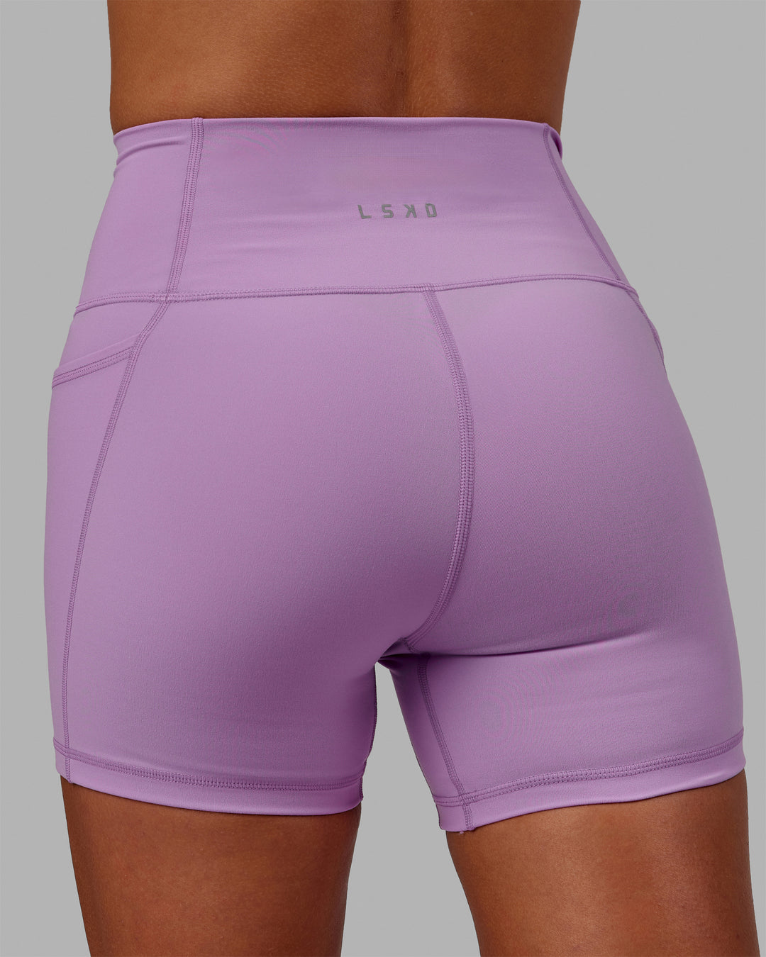 Woman wearing Fusion Ultra High-Rise 4&quot; Short Pockets - Light Violet | Model:Asia | Size:S