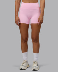 Woman wearing Fusion Ultra High-Rise 4" Short Pockets - Pale Pink | Model:Sophie | Size:S
