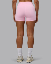 Woman wearing Fusion Ultra High-Rise 4" Short Pockets - Pale Pink | Model:Sophie | Size:S