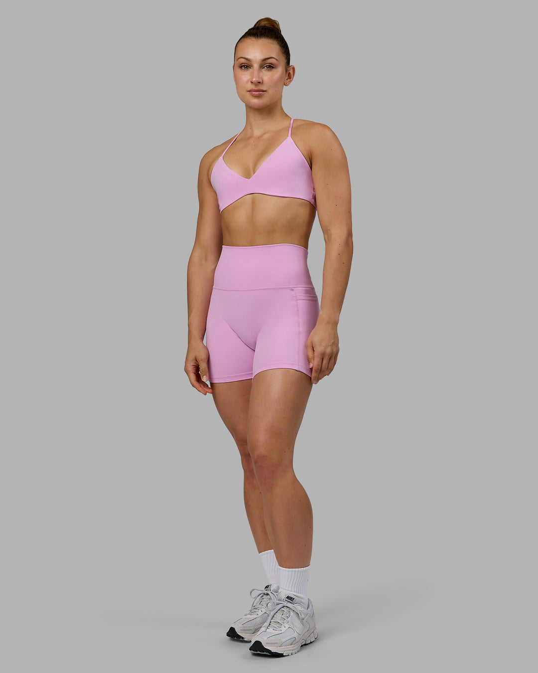 Woman wearing Fusion Ultra High-Rise 4&quot; Short Pockets - Pastel Orchid | Model:Zoe | Size:S