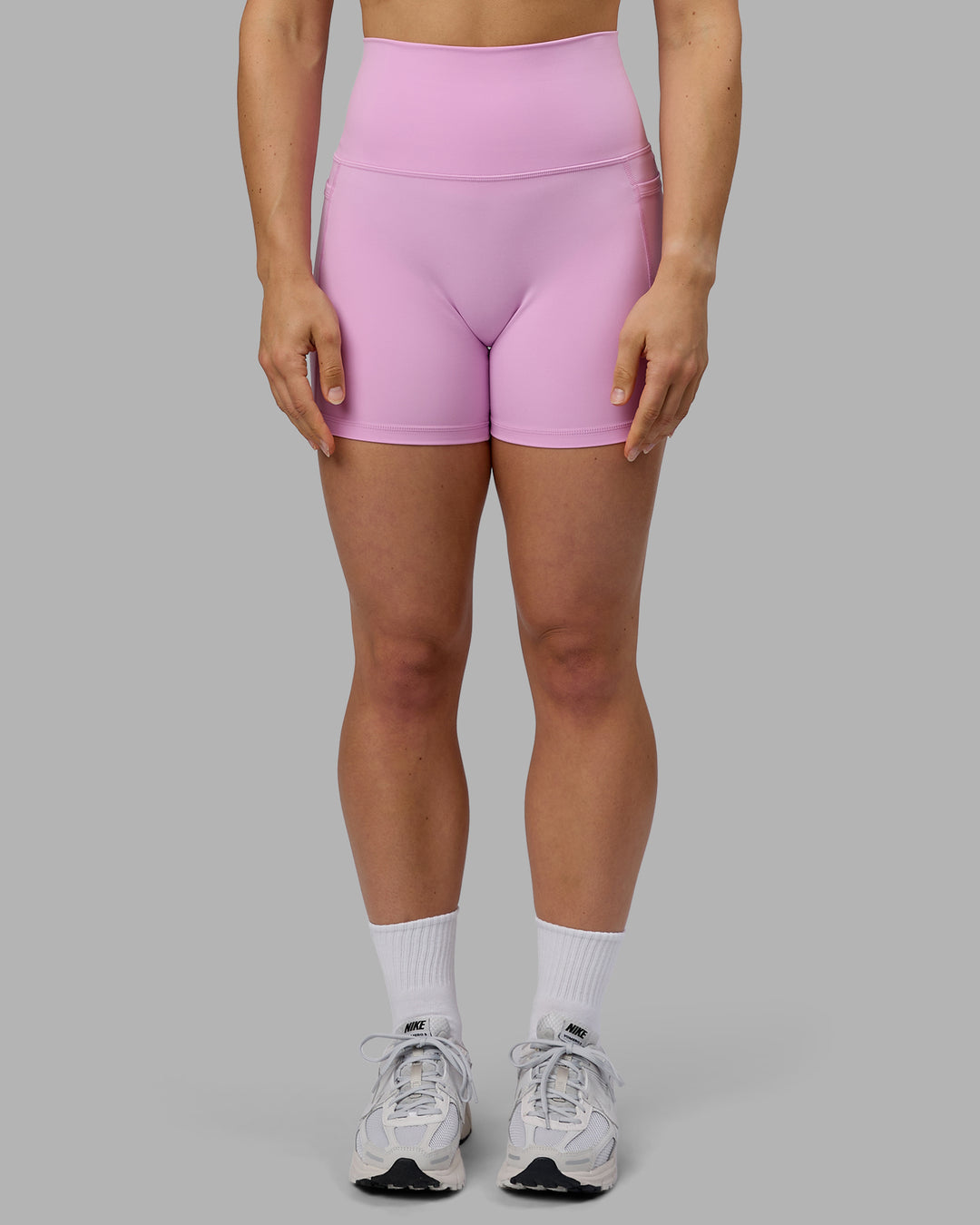 Woman wearing Fusion Ultra High-Rise 4&quot; Short Pockets - Pastel Orchid | Model:Zoe | Size:S