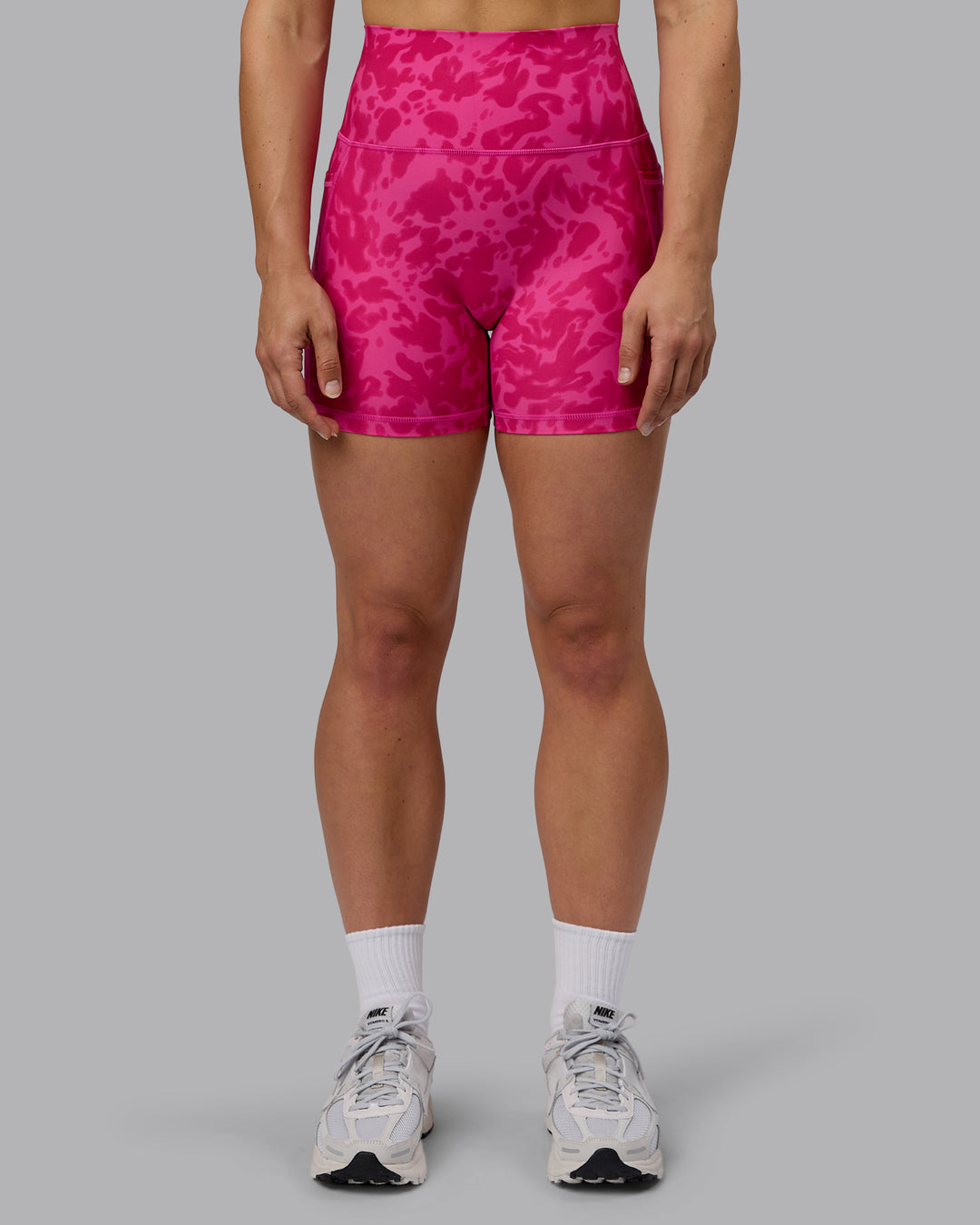 Woman wearing Fusion Ultra High-Rise 4&quot; Short Pockets - Strawberry-Lava Lamp | Model:Zoe | Size:S