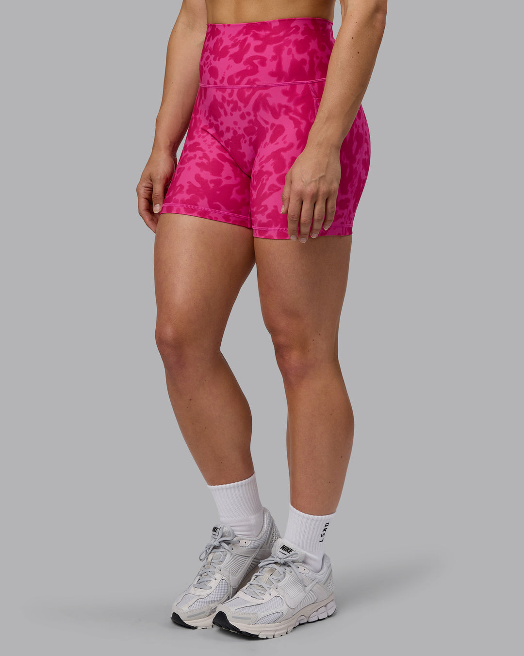 Woman wearing Fusion Ultra High-Rise 4&quot; Short Pockets - Strawberry-Lava Lamp | Model:Zoe | Size:S