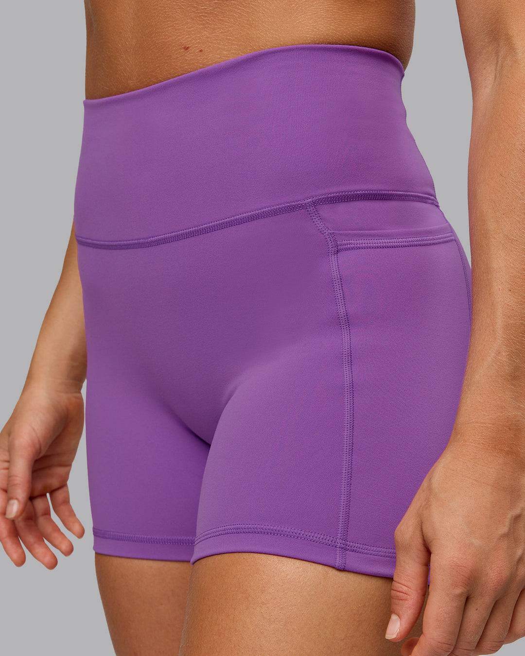 Woman wearing Fusion Ultra High-Rise 4&quot; Short Pockets - Purple Fizz | Model:Shalem | Size:S