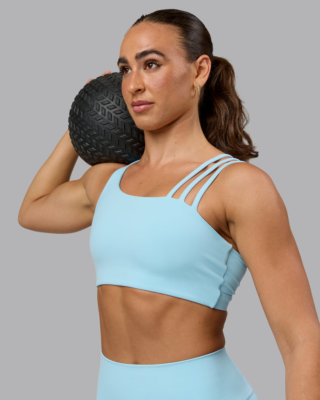 Woman wearing Galvanise Sports Bra - Crystal Blue