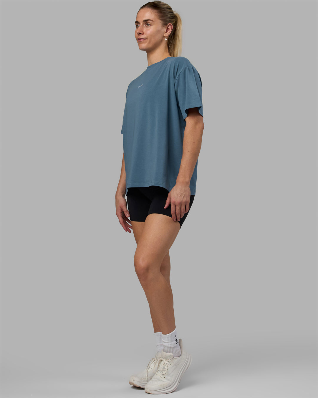 Woman wearing Go-To FLXCotton Oversized Tee - Elemental Blue-White