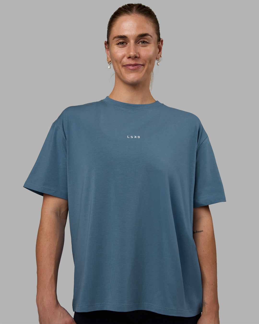 Woman wearing Go-To FLXCotton Oversized Tee - Elemental Blue-White
