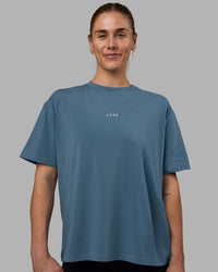 Woman wearing Go-To FLXCotton Oversized Tee - Elemental Blue-White