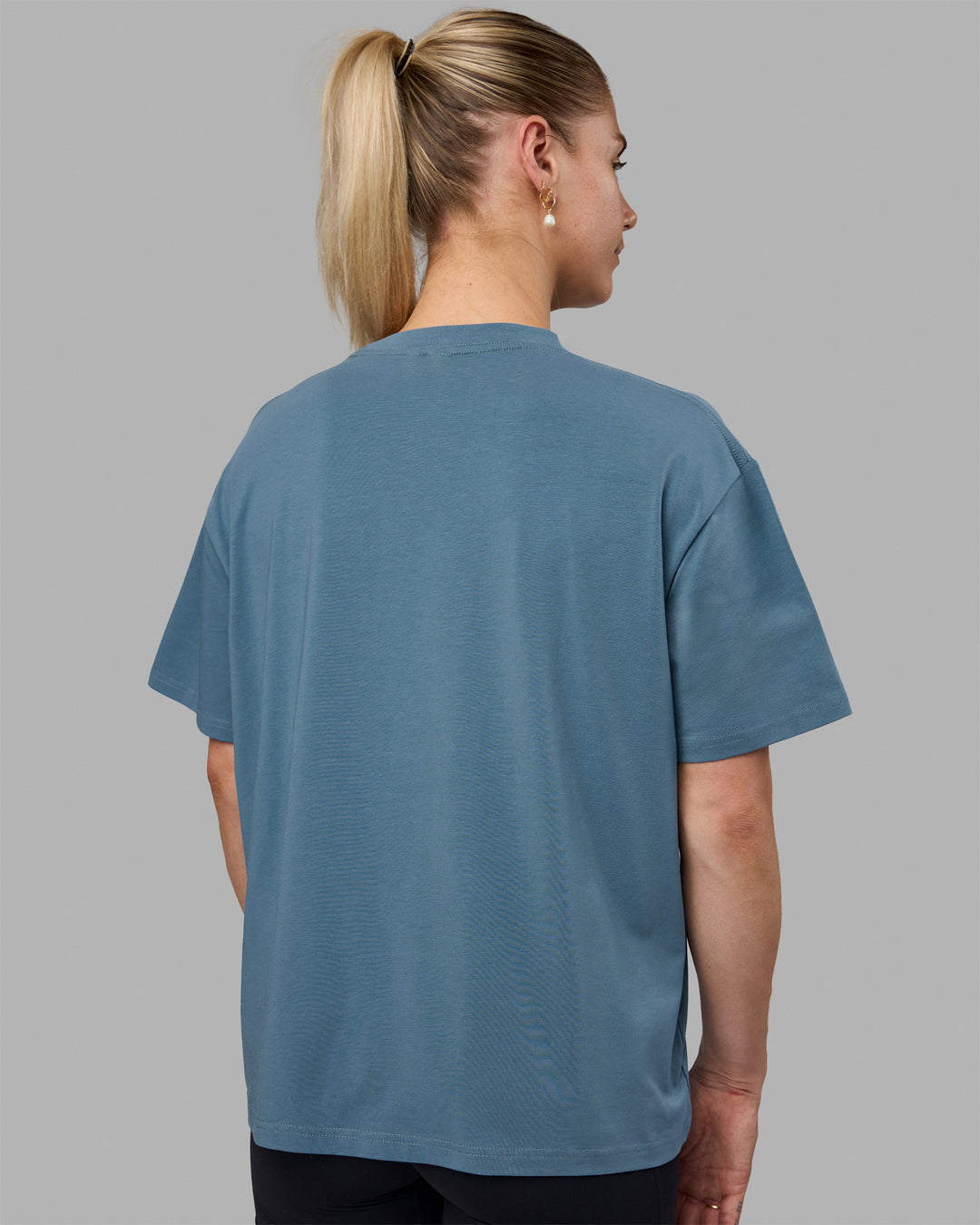 Woman wearing Go-To FLXCotton Oversized Tee - Elemental Blue-White