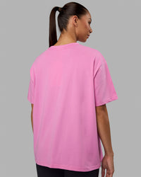 Woman wearing Go-To FLXCotton Oversized Tee - Spark Pink-White