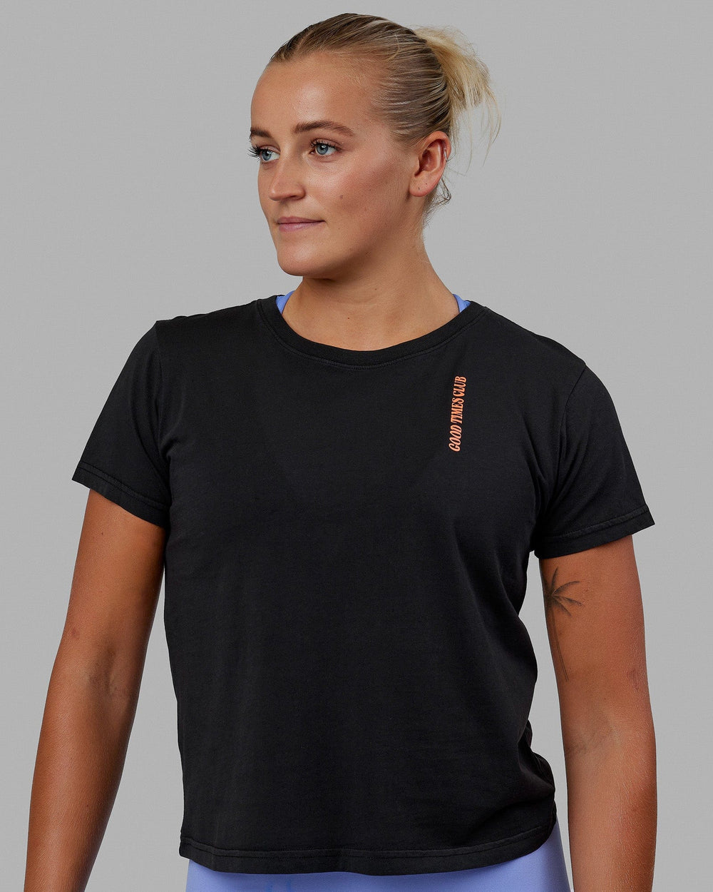 Woman wearing Good Times Global Tee - Black