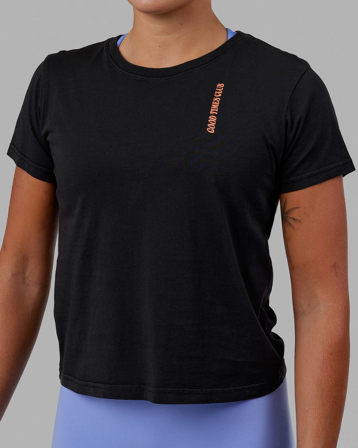 Woman wearing Good Times Global Tee - Black