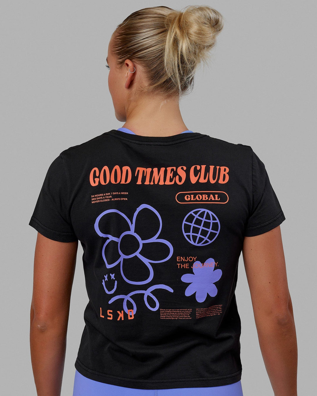 Woman wearing Good Times Global Tee - Black