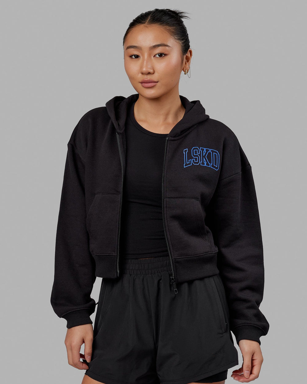 Woman wearing Guild Cropped Hoodie - Black-Power Cobalt