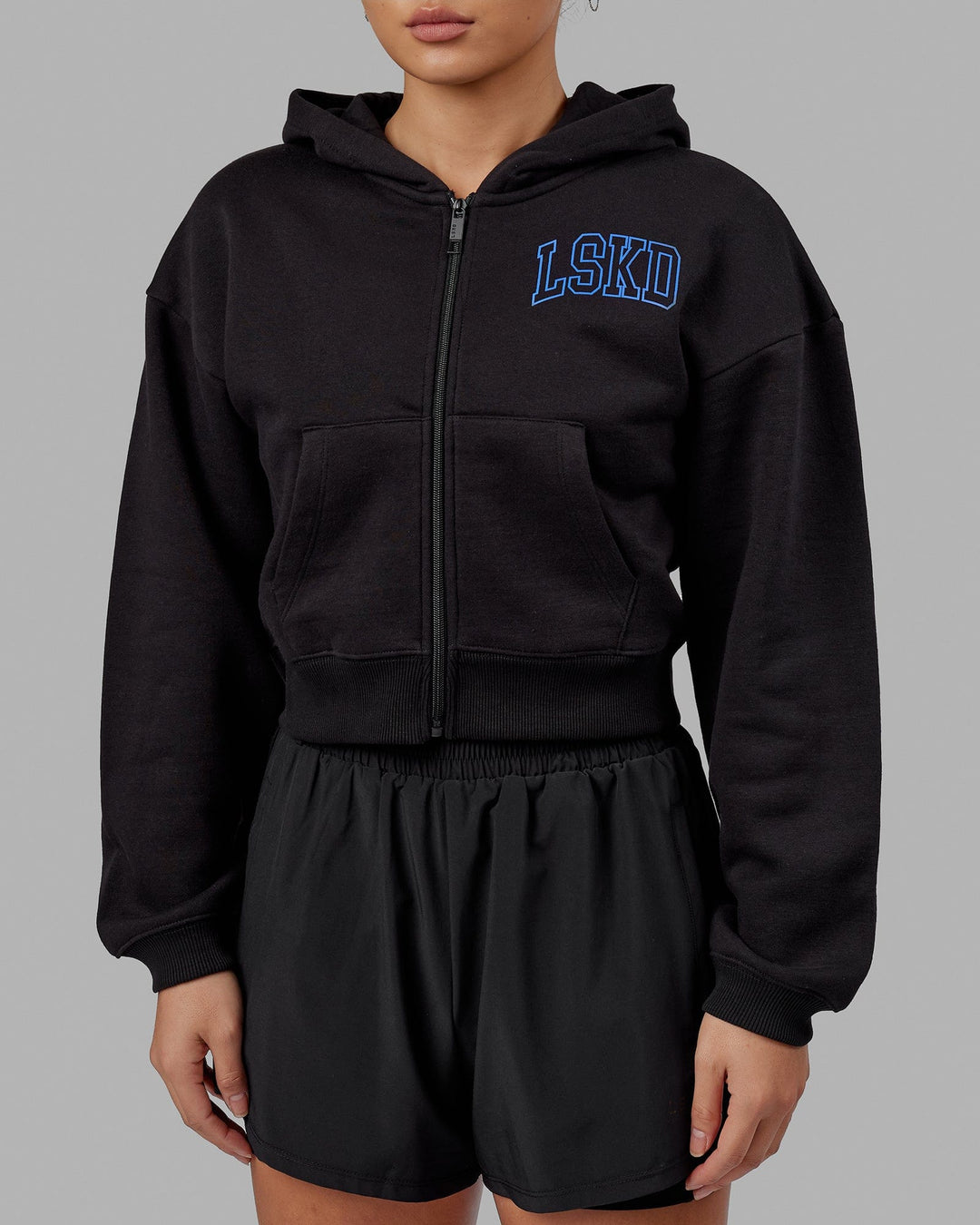 Woman wearing Guild Cropped Hoodie - Black-Power Cobalt