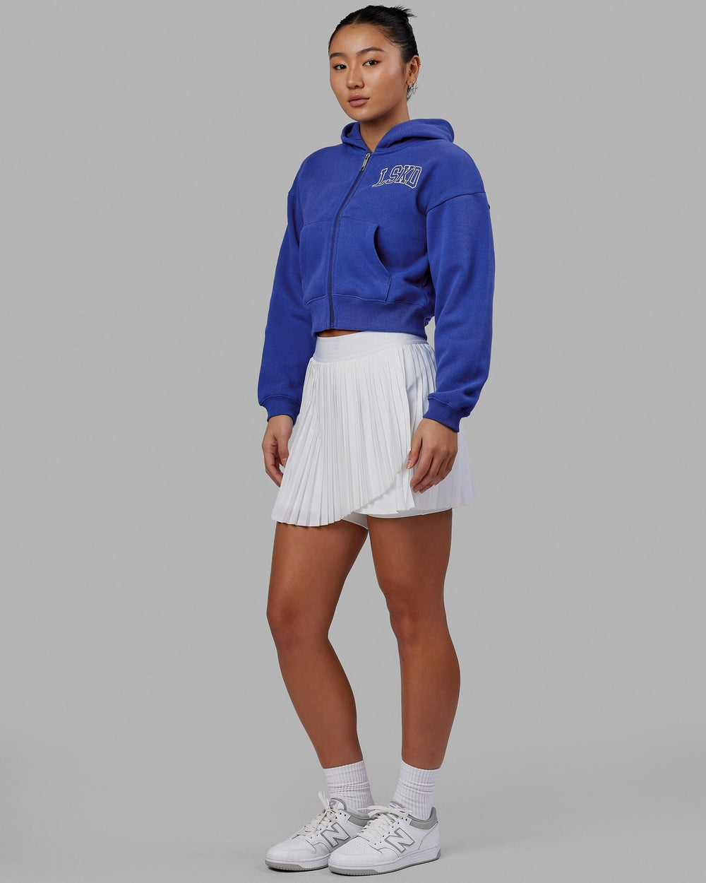 Woman wearing Guild Cropped Hoodie - Power Cobalt-White