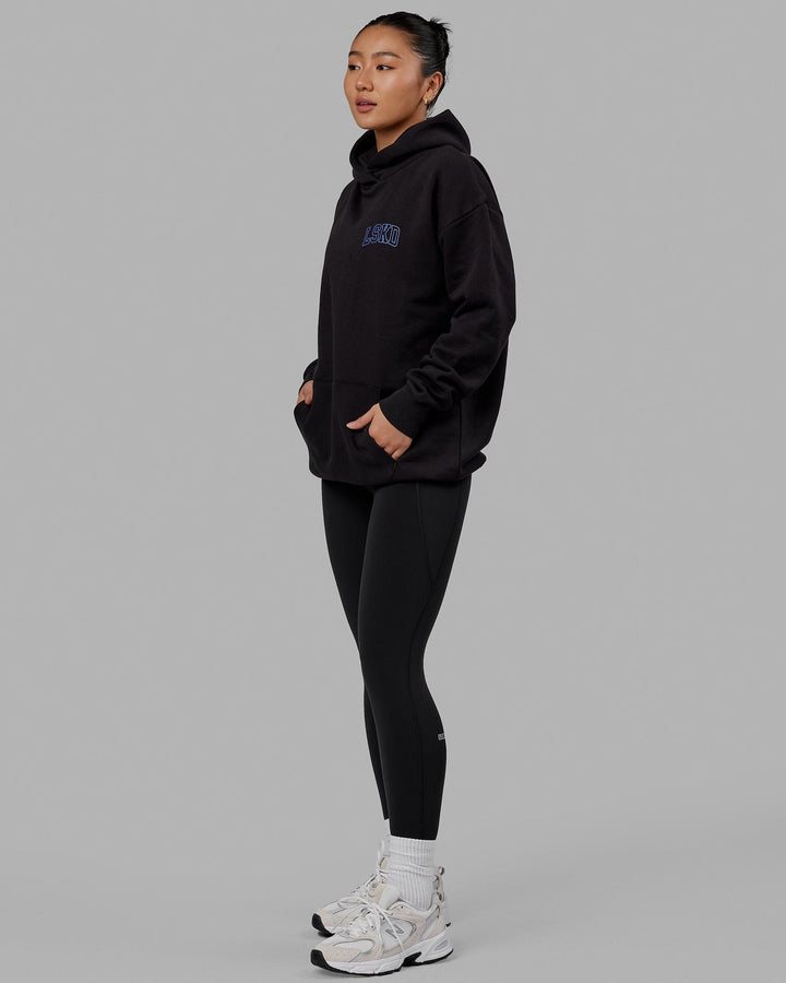 Woman wearing Unisex Guild Hoodie Oversize - Black