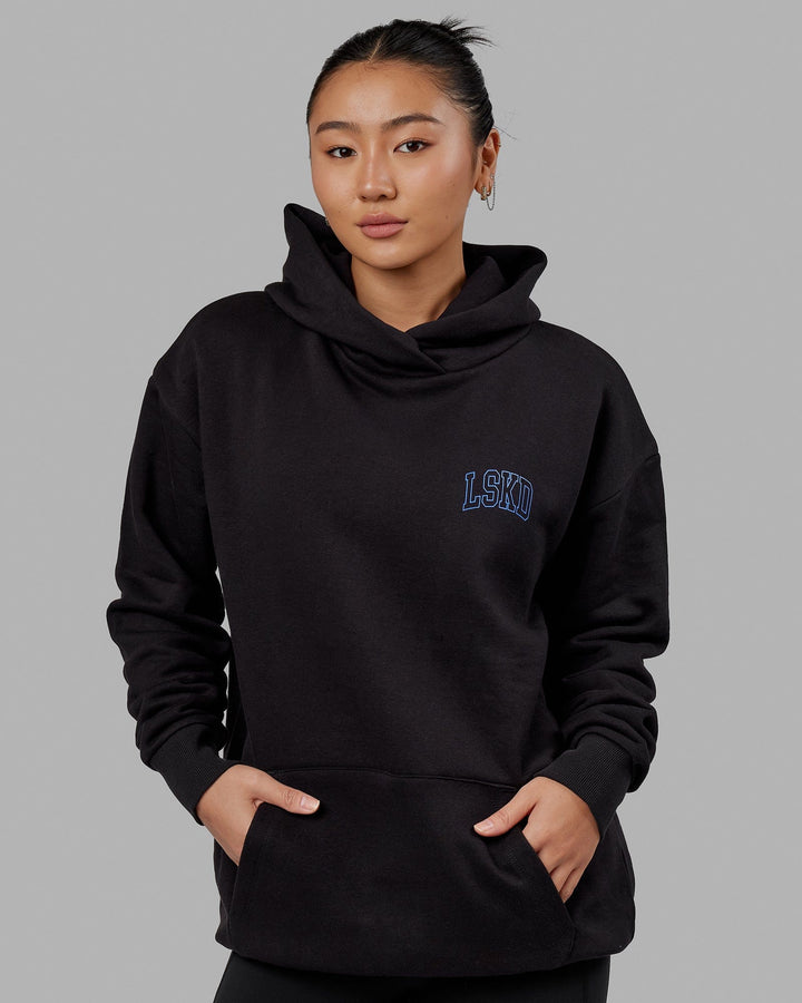 Woman wearing Unisex Guild Hoodie Oversize - Black