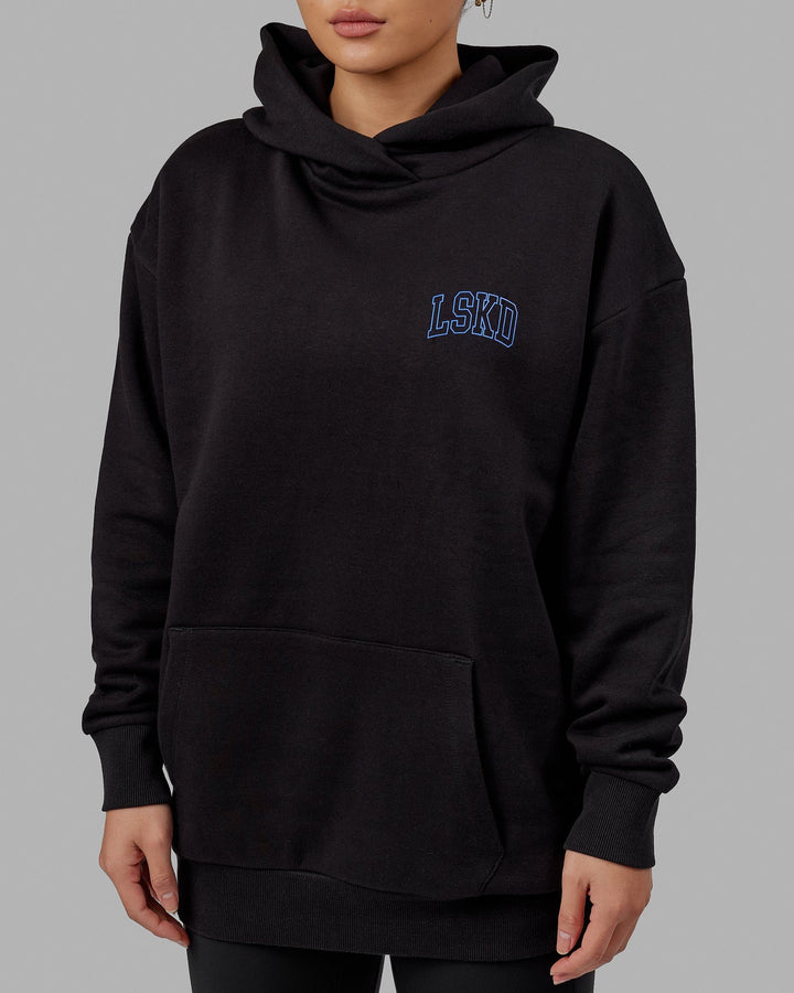 Woman wearing Unisex Guild Hoodie Oversize - Black