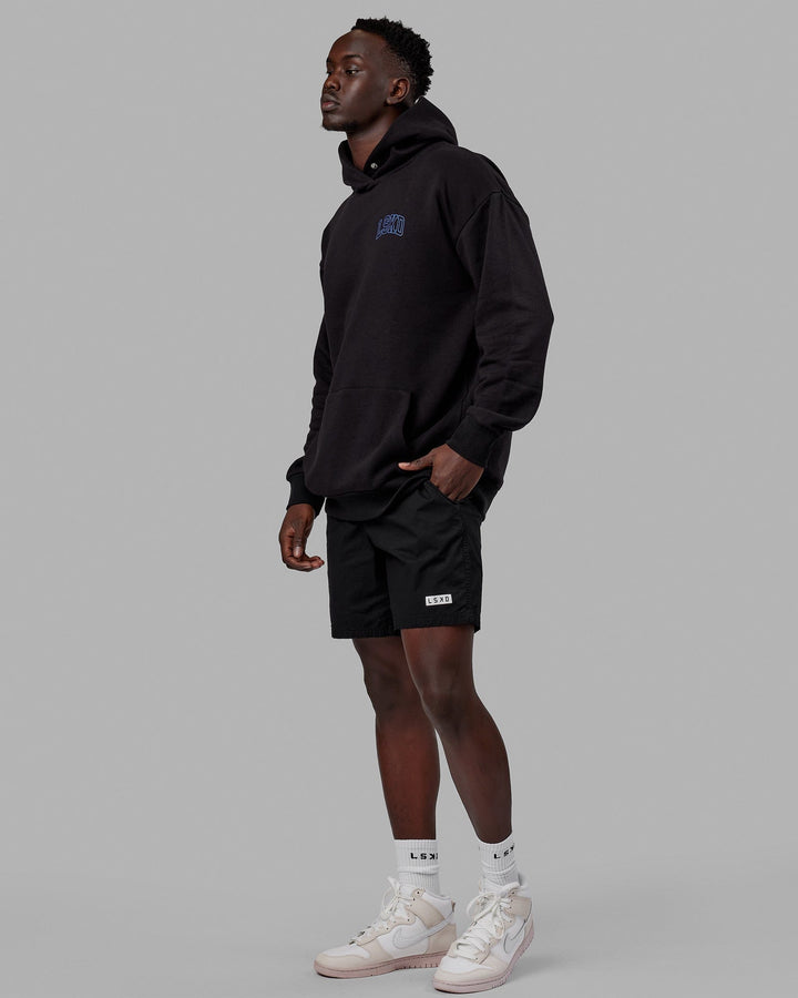 Man wearing Unisex Guild Hoodie Oversize - Black
