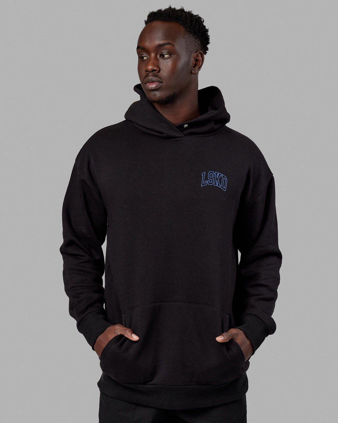 Man wearing Unisex Guild Hoodie Oversize - Black