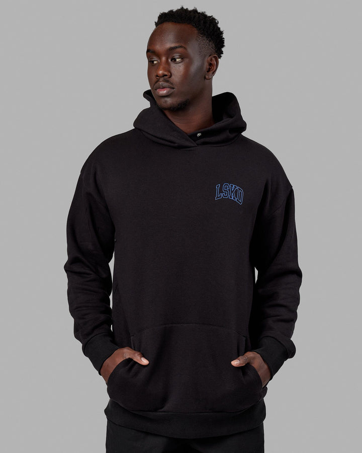 Man wearing Unisex Guild Hoodie Oversize - Black