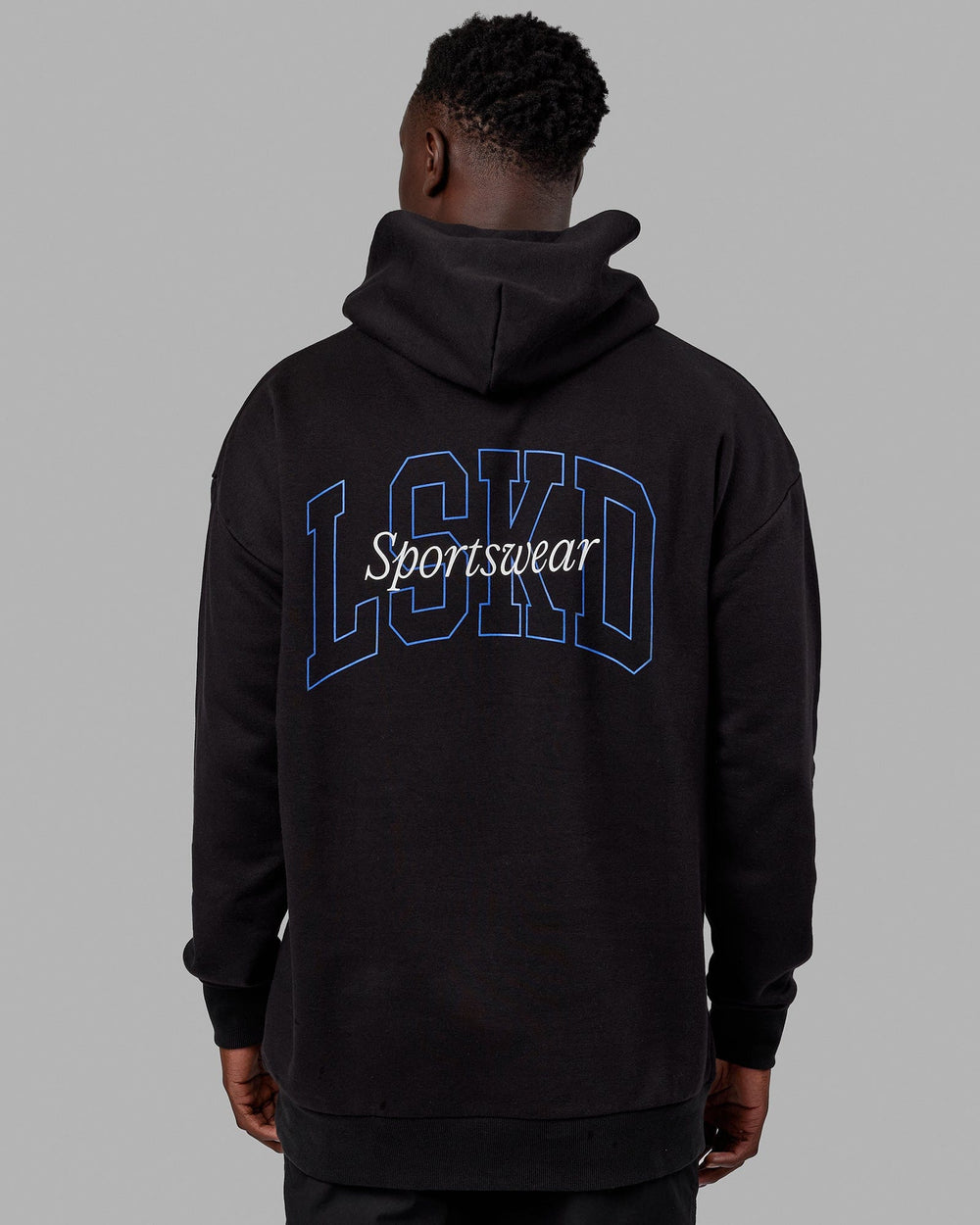 Man wearing Unisex Guild Hoodie Oversize - Black