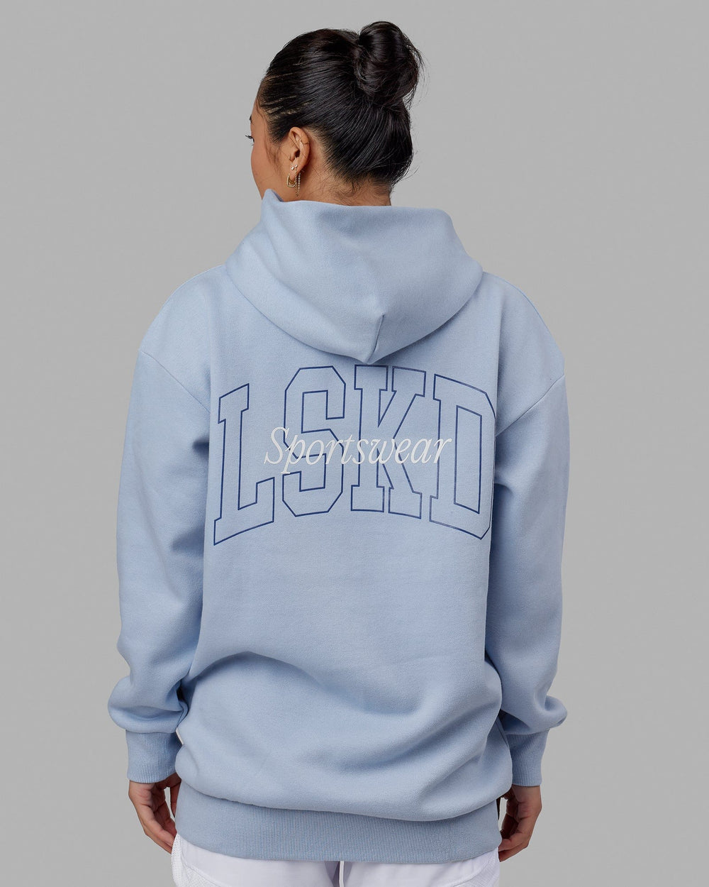 Woman wearing Unisex Guild Hoodie Oversize - Windsurfer