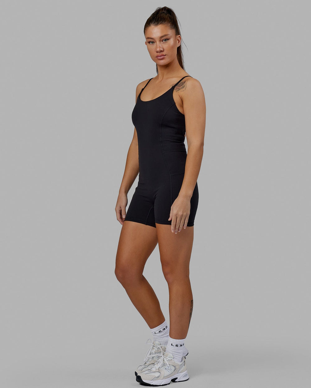 Woman wearing Helix Active Bodysuit - Black